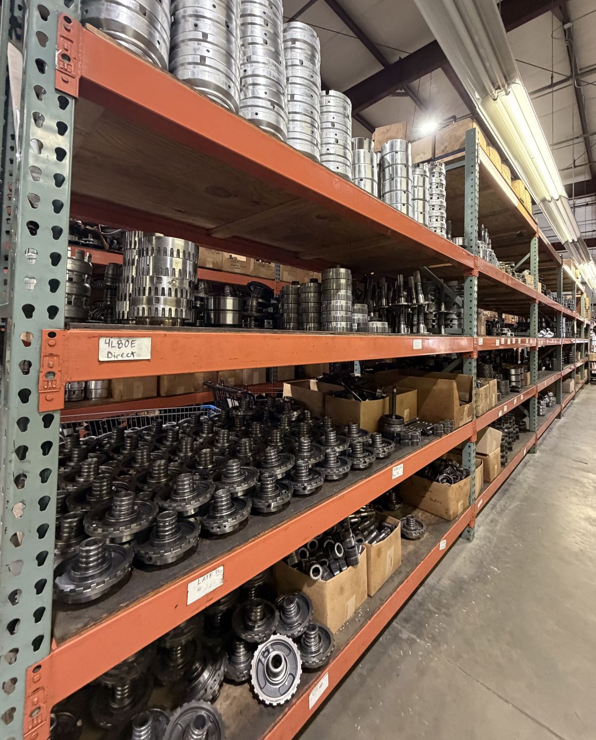 Shelves of transmission hard parts at Teal Automotive
