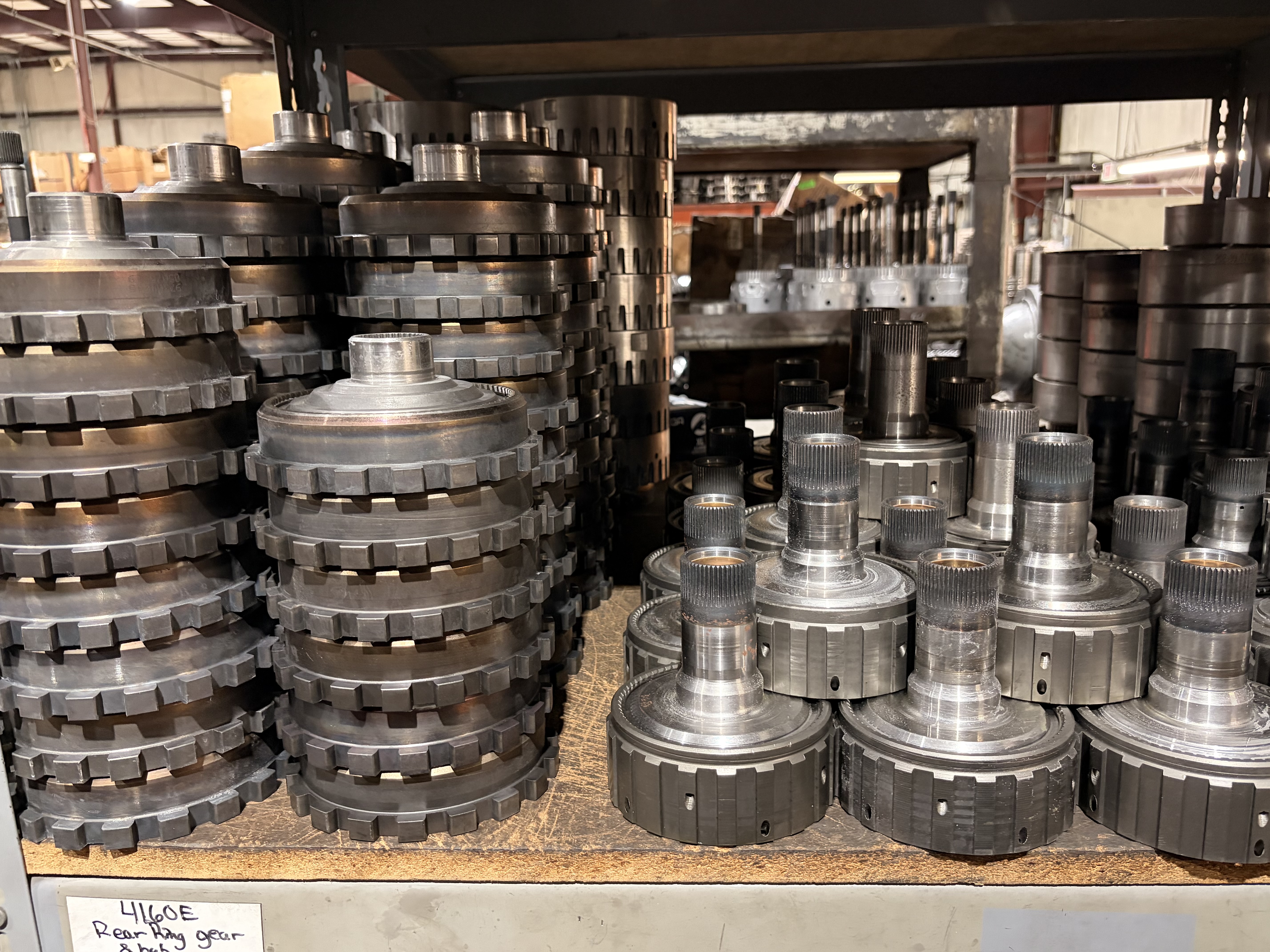 Shelves of transmission hard parts at Teal Automotive